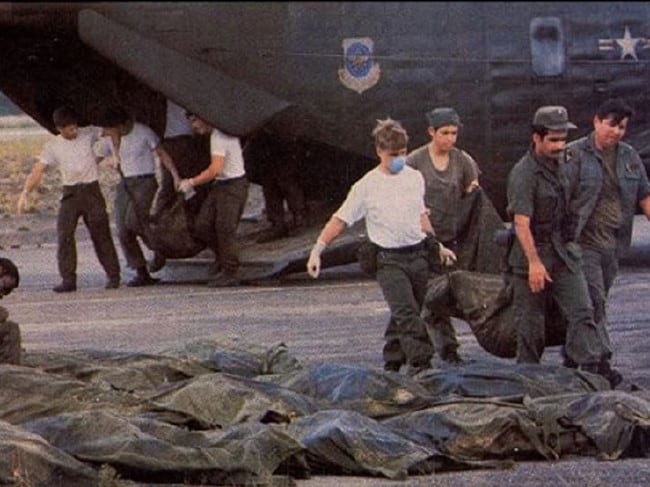 U.S. Military Officials removing the bodies.