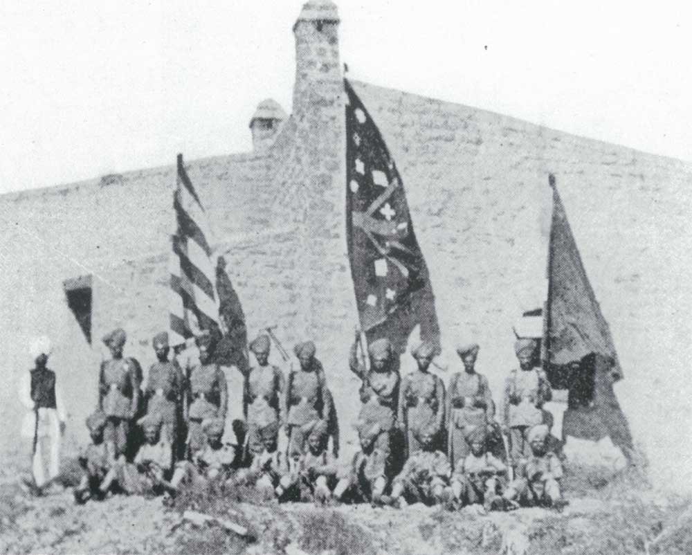 Survivors of the Gulistan party pose with the captured Afridis for a photograph.