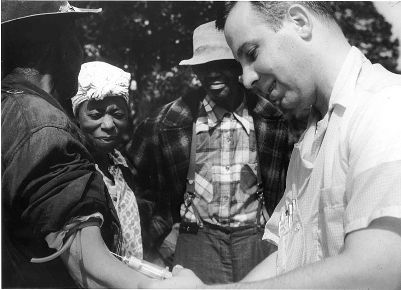 A doctor draws blood from one of the Tuskegee test subjects
