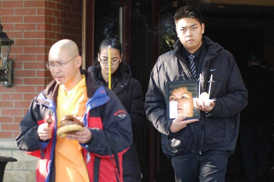 Pictured L-R - Jennifer Pan with her brother Felix Pan at her mother's funeral