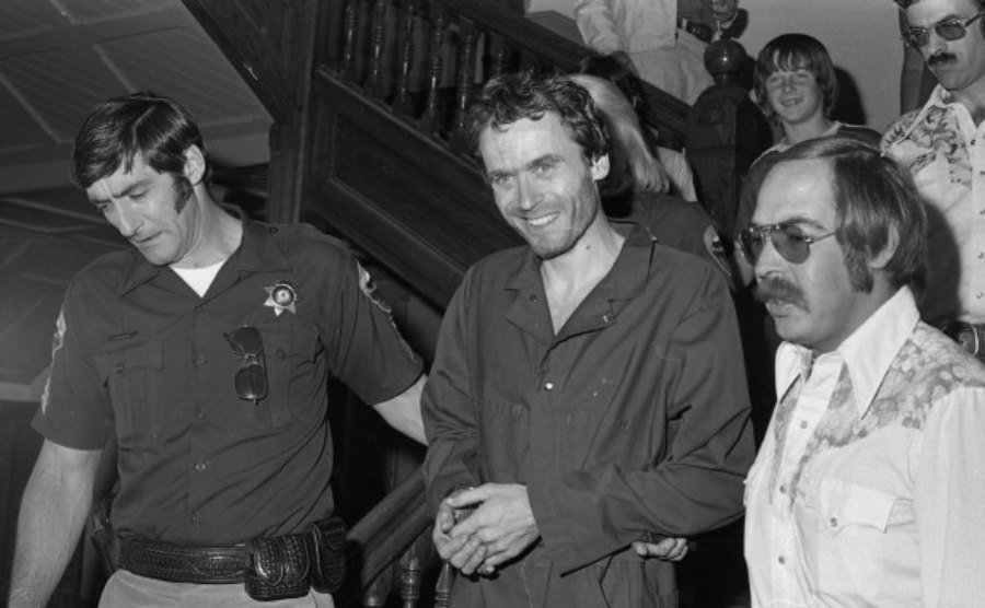 Ted Bundy smiling as he was arrested 